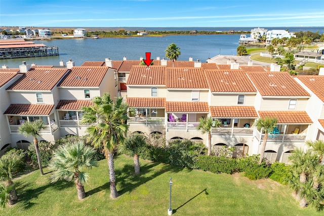 birds eye view of property with a water view