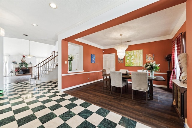 dining room featuring crown molding, a textured ceiling, a wealth of natural light, a notable chandelier, and dark hardwood / wood-style flooring