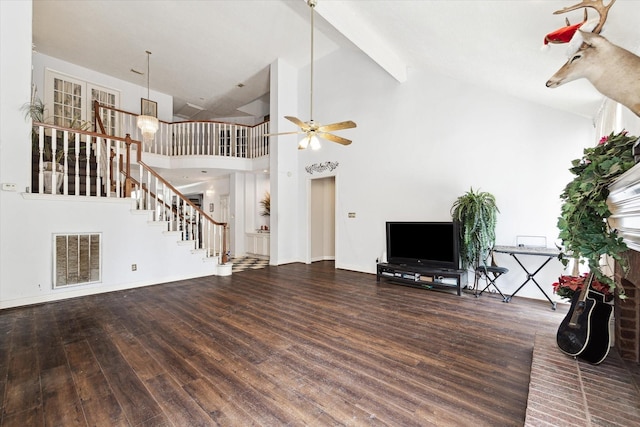 unfurnished living room with ceiling fan, wood-type flooring, and high vaulted ceiling