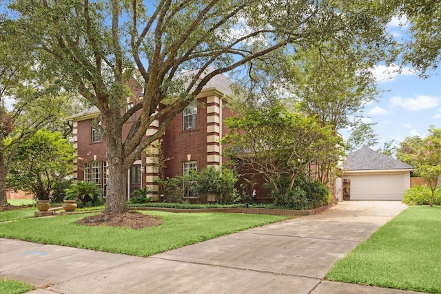 view of front of home with a front yard and a garage