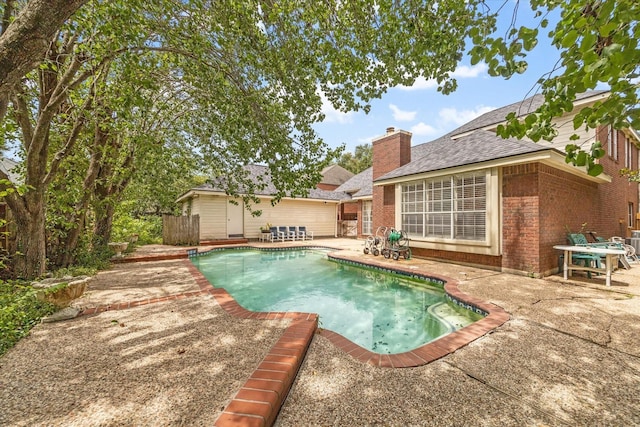 view of swimming pool featuring a patio