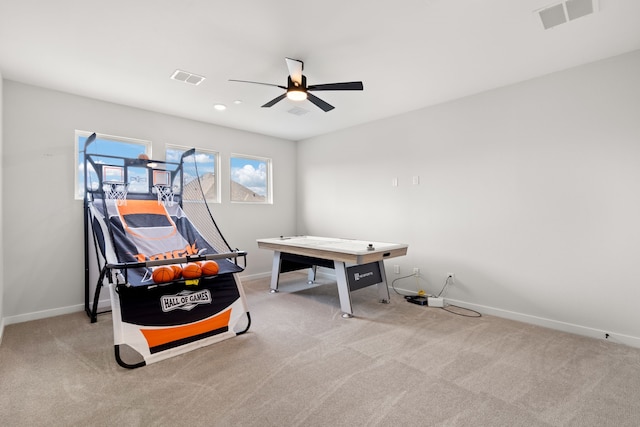 game room with light carpet and ceiling fan