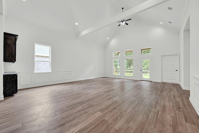525 Little Spring Ct, Anahuac, TX 77514 - unfurnished living room featuring high vaulted ceiling, light wood-type flooring, beam ceiling, a ceiling fan, and recessed lighting