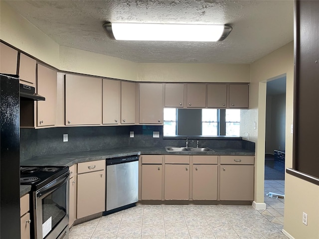 kitchen featuring sink, light tile patterned floors, appliances with stainless steel finishes, ventilation hood, and a textured ceiling