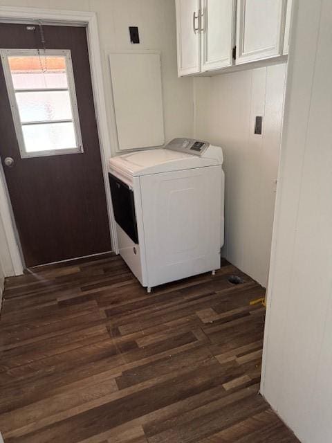 washroom featuring cabinets, dark hardwood / wood-style flooring, and washer / dryer