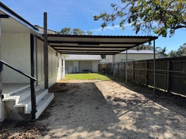 view of yard featuring a carport