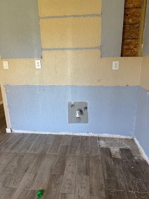 laundry room with dark wood-type flooring