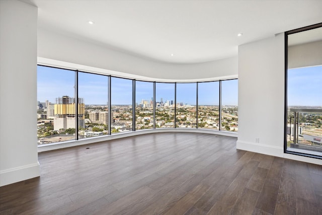 unfurnished room featuring dark hardwood / wood-style flooring