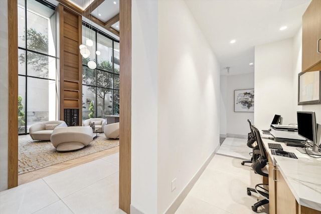 tiled home office with a high ceiling