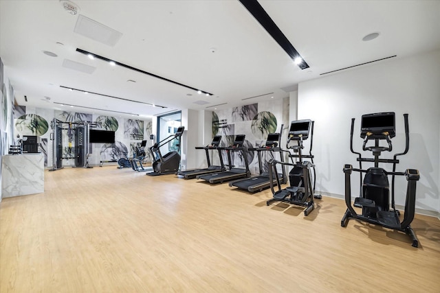 workout area featuring hardwood / wood-style flooring