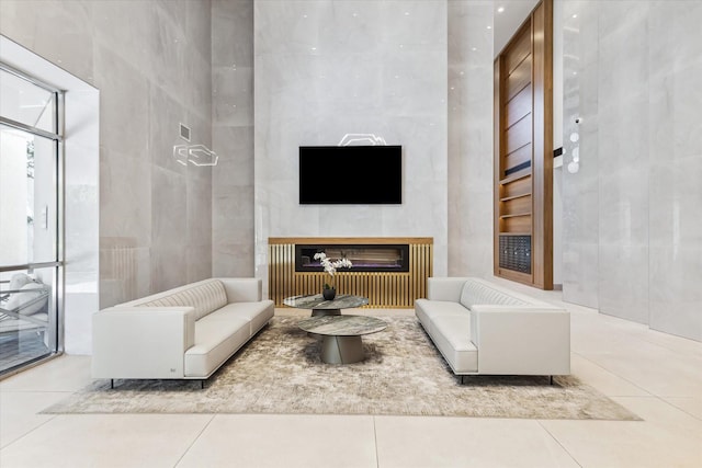 tiled living room featuring a fireplace