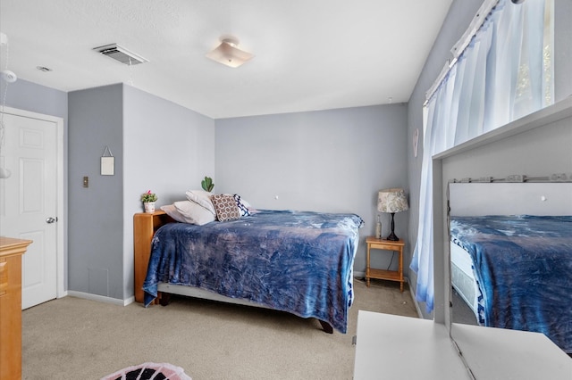 bedroom featuring light colored carpet