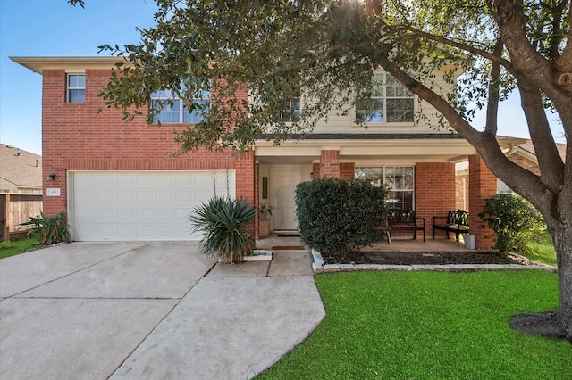 view of front of home featuring a garage and a front yard