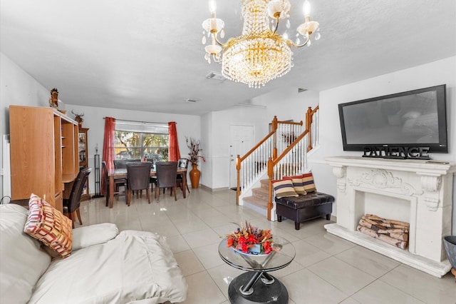 living room with tile patterned floors, a high end fireplace, and a chandelier