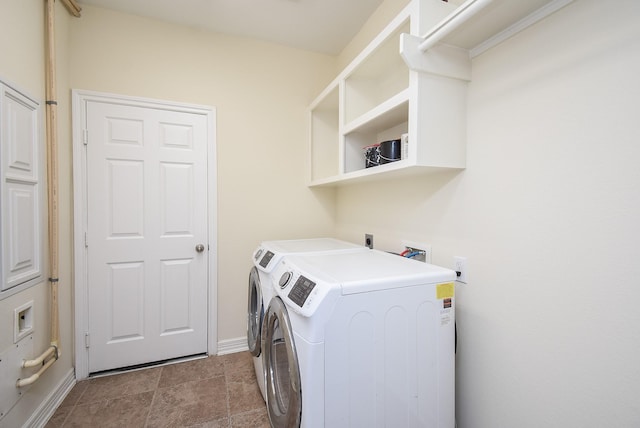 clothes washing area featuring separate washer and dryer