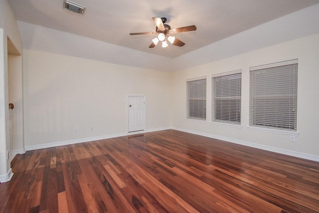 empty room with dark hardwood / wood-style flooring and ceiling fan