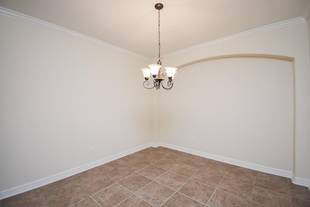 tiled empty room featuring crown molding and a chandelier