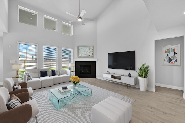 23411 Persimmon Creek Ln, Katy, TX 77493 - living room featuring ceiling fan, high vaulted ceiling, and light hardwood / wood-style floors