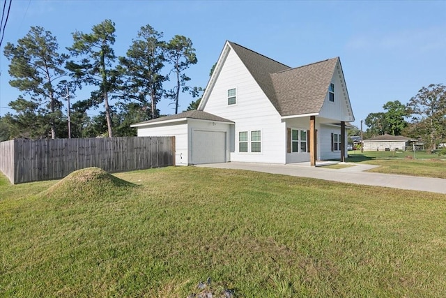 exterior space with a yard and a garage