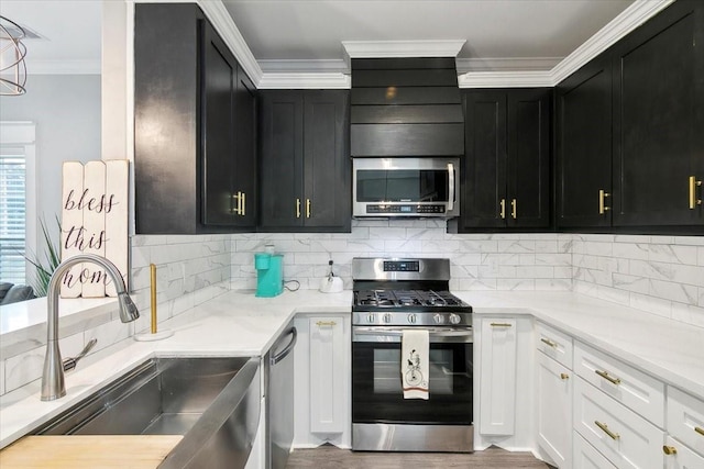 kitchen featuring white cabinets, hardwood / wood-style floors, stainless steel appliances, and sink