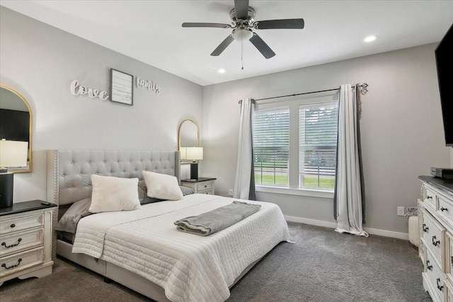 bedroom featuring ceiling fan and dark colored carpet