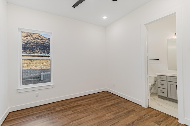 unfurnished room featuring wood-type flooring and ceiling fan