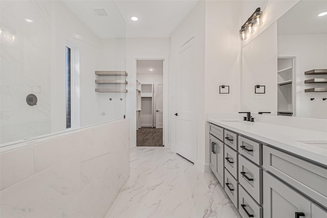 bathroom with vanity and walk in shower