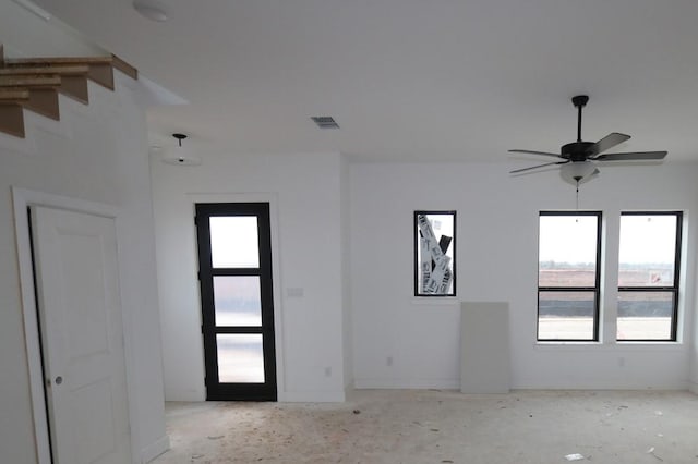 unfurnished room with ceiling fan