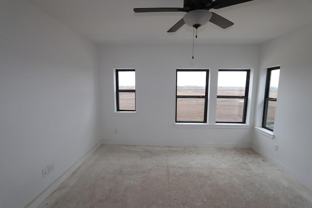3411 Loam Ln, Richmond, TX 77406 - unfurnished room featuring healthy amount of natural light, ceiling fan, and concrete floors