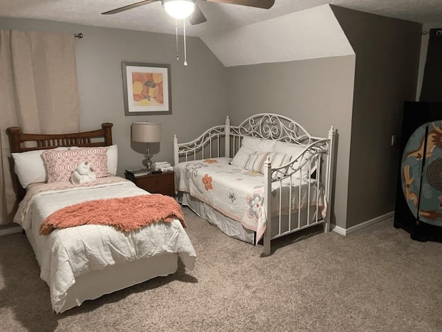 carpeted bedroom with ceiling fan, lofted ceiling, and a textured ceiling