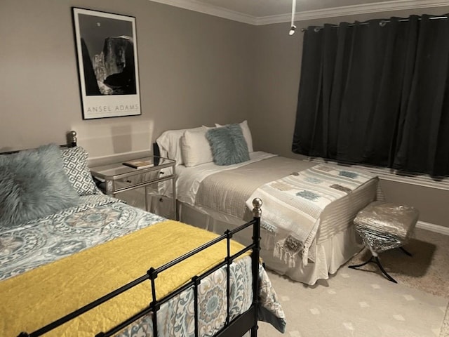 bedroom with ornamental molding and carpet floors