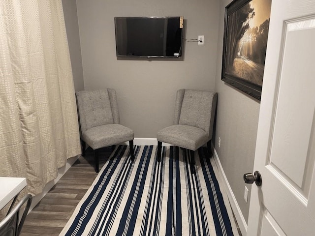 sitting room with hardwood / wood-style floors