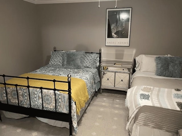 carpeted bedroom with ornamental molding