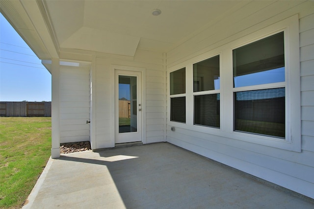 view of patio featuring fence