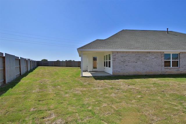 view of yard with a patio area and a fenced backyard