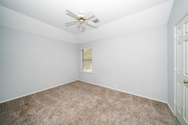 carpeted empty room featuring lofted ceiling and ceiling fan