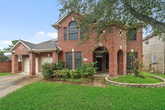 view of front property with a garage and a front yard