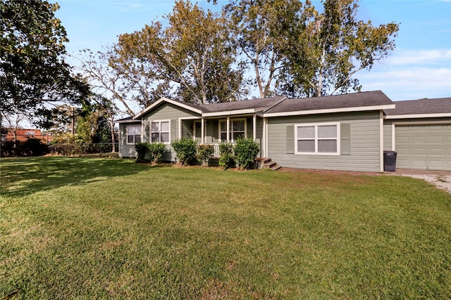 single story home featuring a front yard and a garage