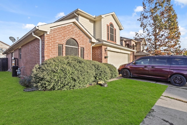 view of front of home featuring a front yard and a garage