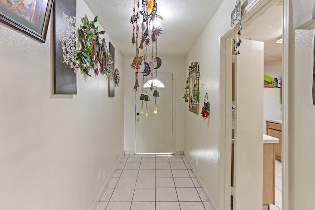 entryway featuring light tile patterned flooring