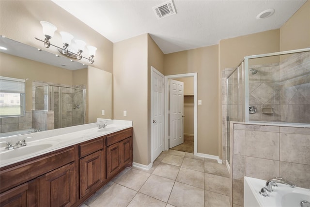 bathroom with tile patterned flooring, vanity, and independent shower and bath