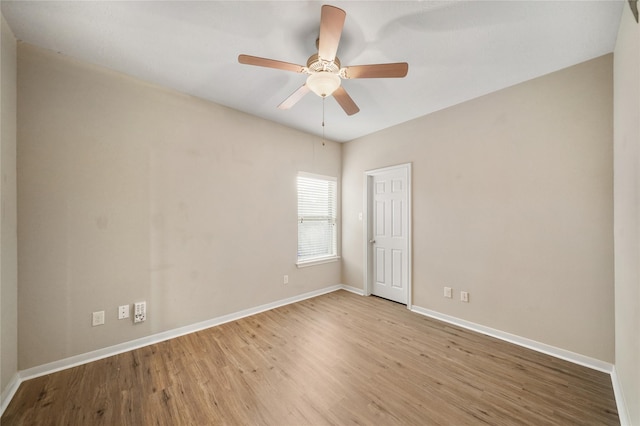 unfurnished room featuring ceiling fan and light wood-type flooring