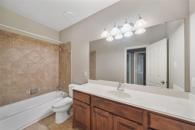 full bathroom with toilet, vanity, tiled shower / bath combo, and tile patterned floors