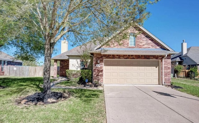 view of front facade with a front yard and a garage