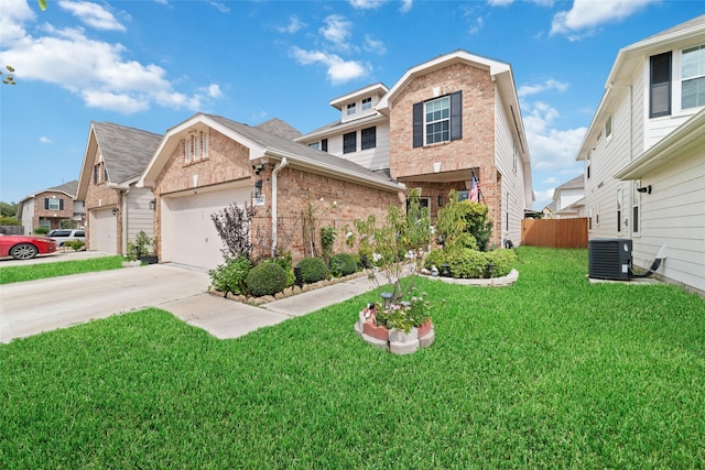 view of front of house with a garage, a front yard, and central AC