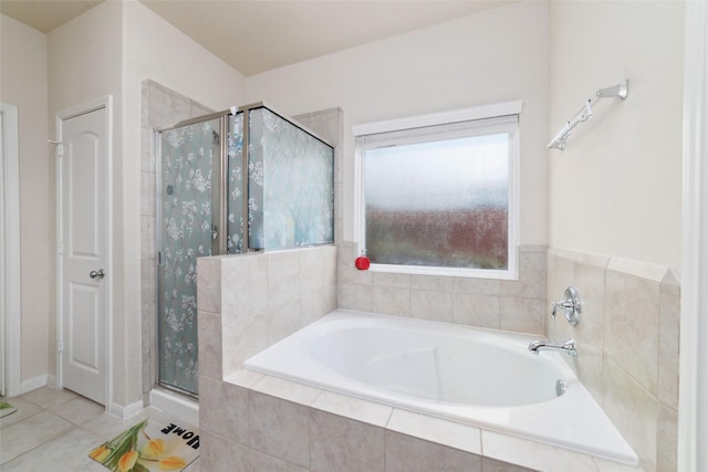 bathroom with tile patterned flooring and independent shower and bath