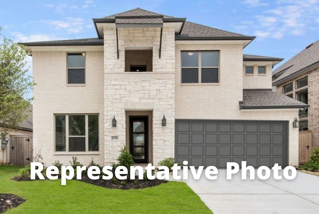 view of front of house featuring a garage and a front lawn