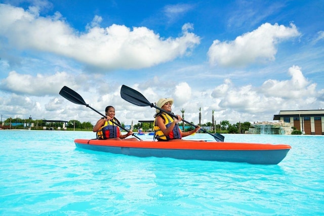 view of swimming pool with a water view