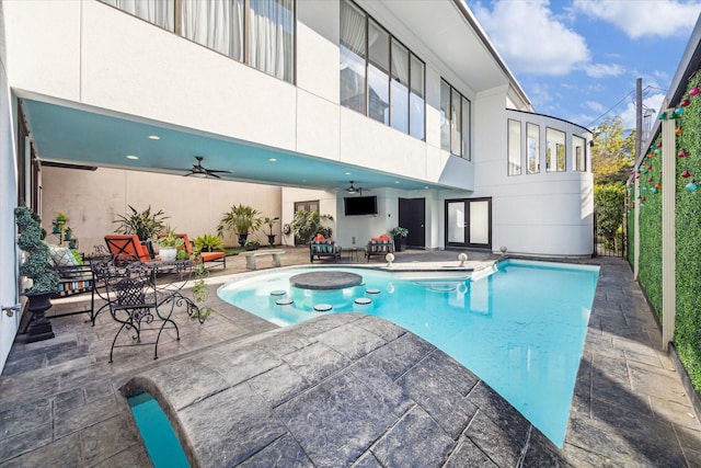 view of swimming pool with a patio area and ceiling fan