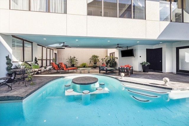 view of pool featuring a patio and ceiling fan